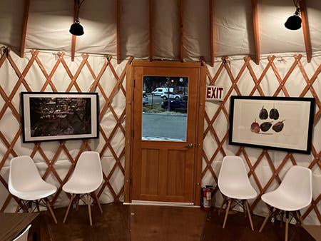 Seating arranged against yurt lattice walls