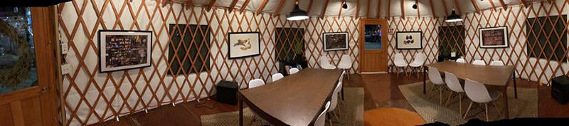 Tables and chairs inside a restaurant yurt