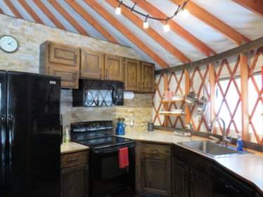 Kitchen island and appliances in a yurt