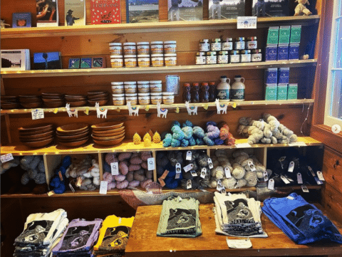 Farm shop shelves stocked with food and goods