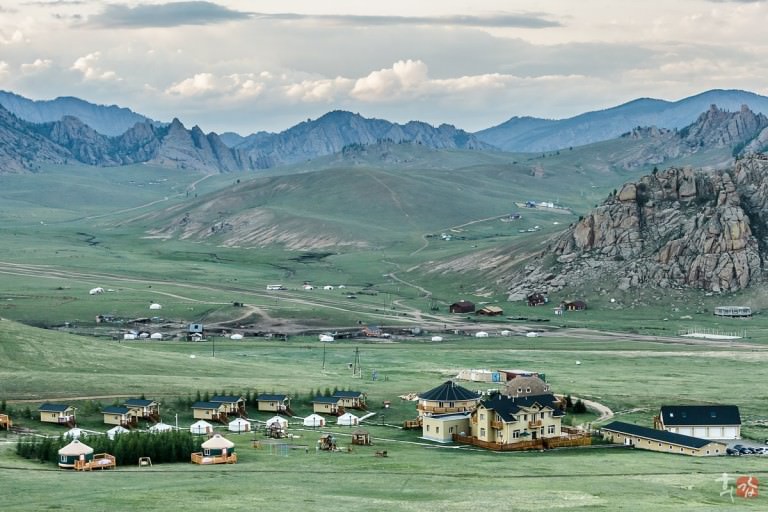 Lodge buildings in a broad mountain valley