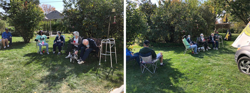 Guests gathered in a leafy backyard