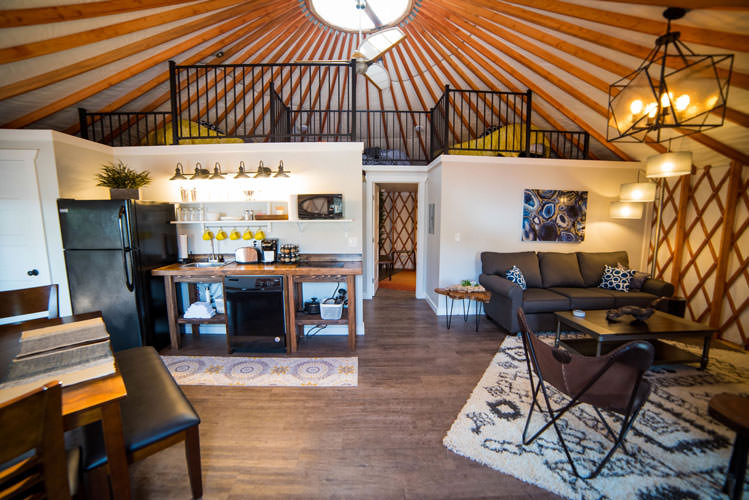 Open-plan yurt kitchen and living room