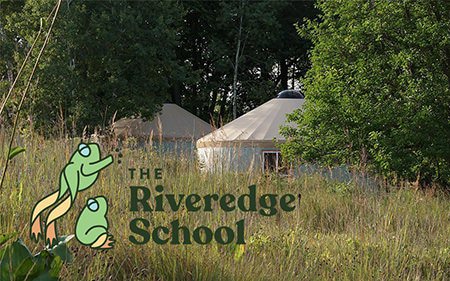Riveredge School sign beside a yurt