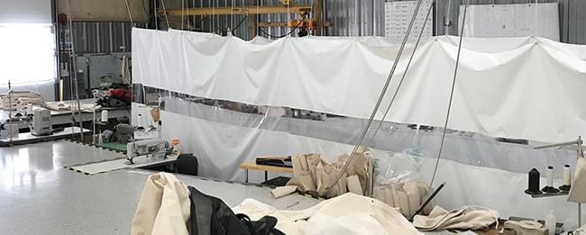 Protective fabric partitions in a workshop