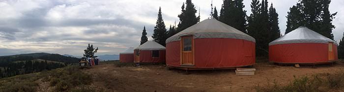 Two yurts in an open landscape