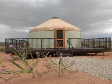 Yurt on a raised deck in a dry landscape